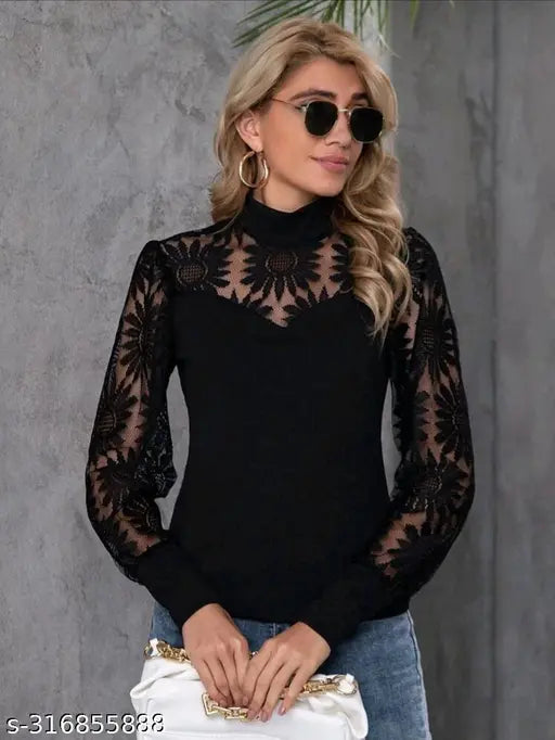 black lace long-sleeved top. She carries a white handbag and exudes a stylish, modern vibe.