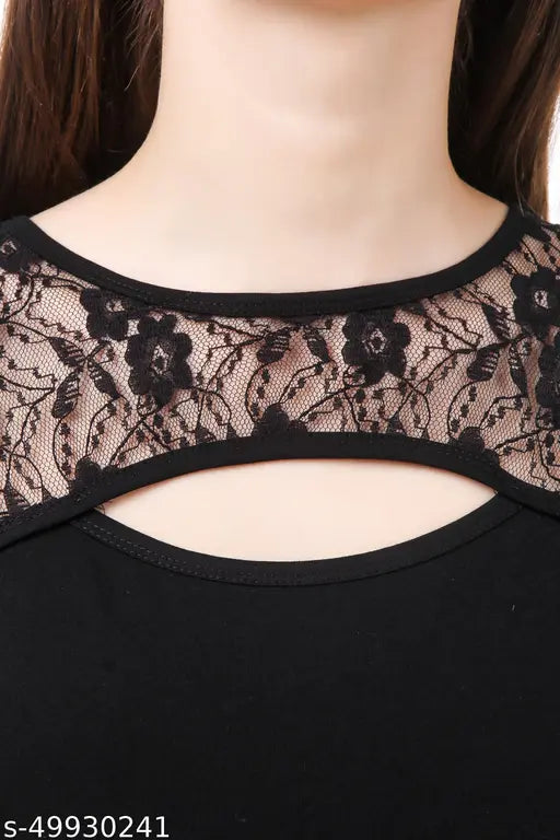 Close-up of a woman's neckline wearing a black top with intricate floral lace detailing. The lace creates an elegant, sophisticated look.