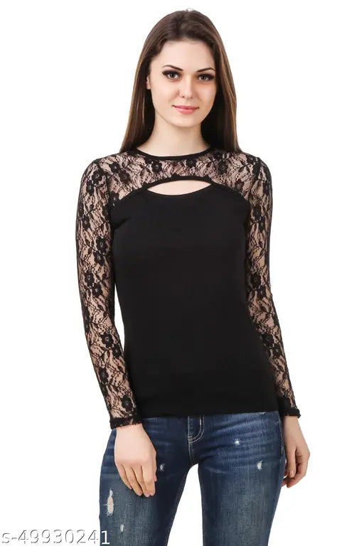 black top with lace sleeves and a keyhole neckline stands confidently. She pairs it with distressed jeans, exuding a stylish and composed vibe.