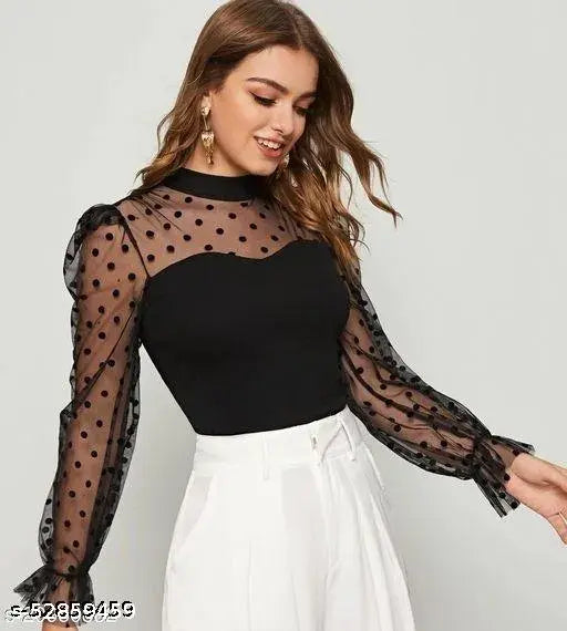 black top with sheer polka dot sleeves and a fitted bodice, matched with high-waisted white pants. The look is elegant and stylish.