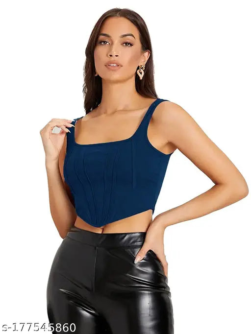  blue sleeveless corset crop top, black leather pants and gold earrings, exuding a stylish and bold vibe.