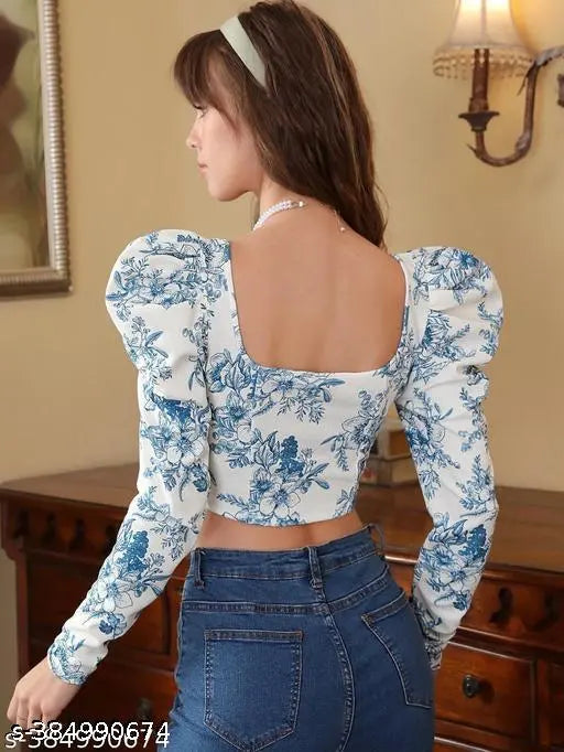 floral blue and white puff-sleeve corset top with jeans and a blue headband, exuding a calm, elegant vibe. beautiful long sleeve corset floral top