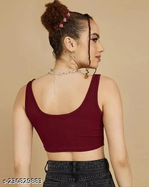 burgundy corset crop top, black jeans chunky silver chain necklace.