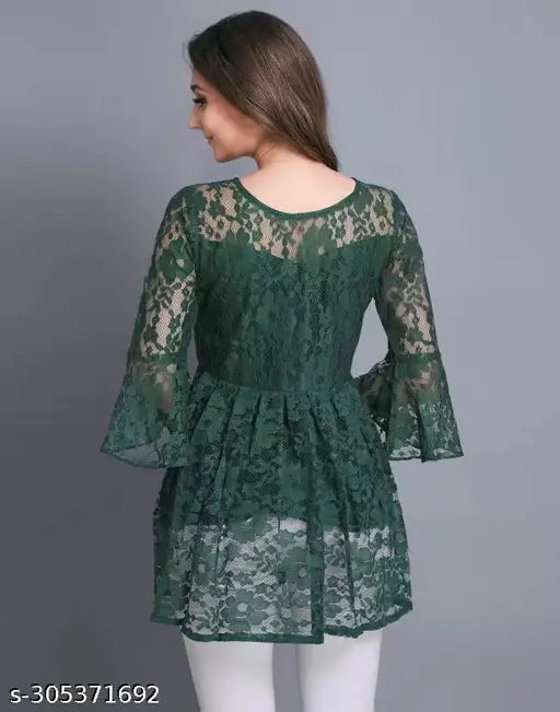  green lace tunic with bell sleeves, turning , creating an elegant tone.