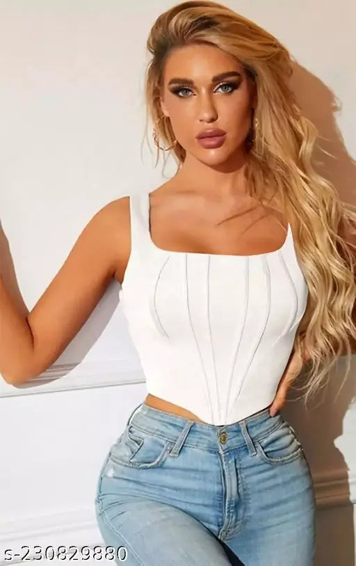 white corset top and light blue jeans, confident and stylish. corset top for women